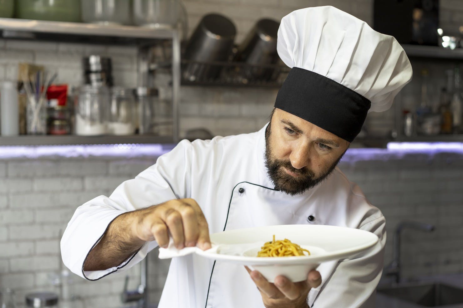 portrait-male-chef-kitchen-holding-plate-food.jpg